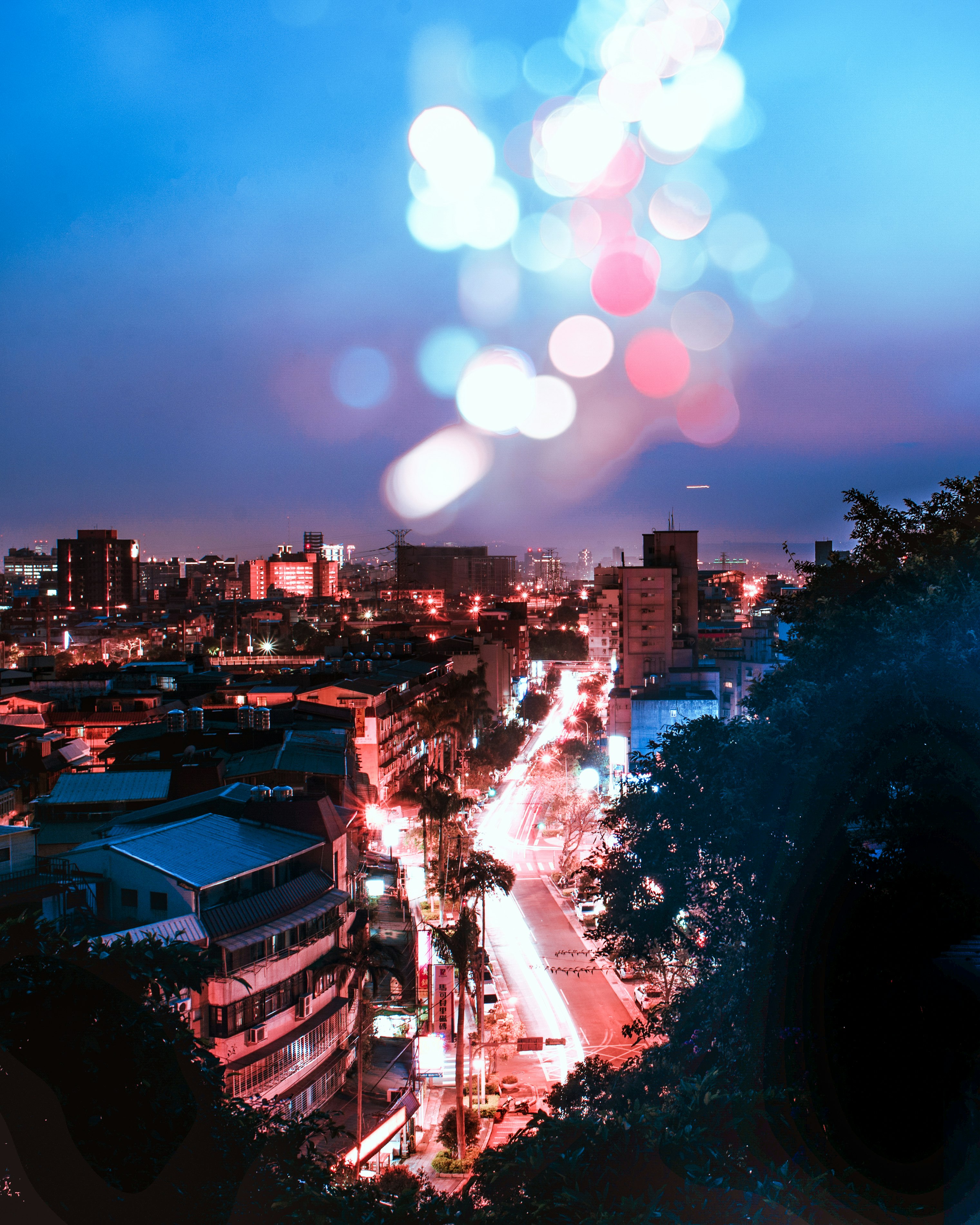 city with high rise buildings during night time